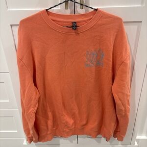 Salty Crew Coral Sweatshirt with Blue Graphic